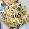 Mushroom noodles with spinach and creme fraiche on plate