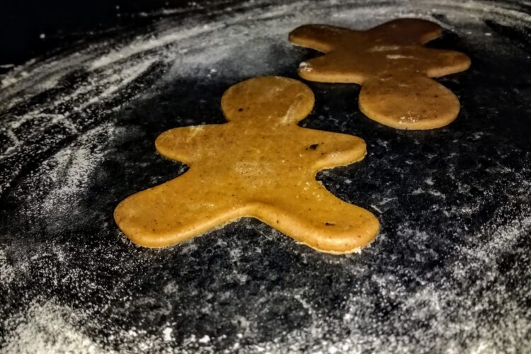 raw gingerbread dough - gingerbread men shaped