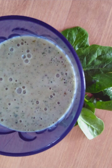 Green smoothie in a blue glass